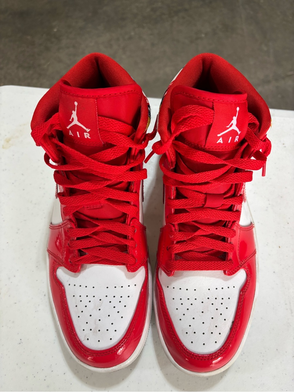 Jordan Red and White High-Top Sneaker with Multicolor Accent